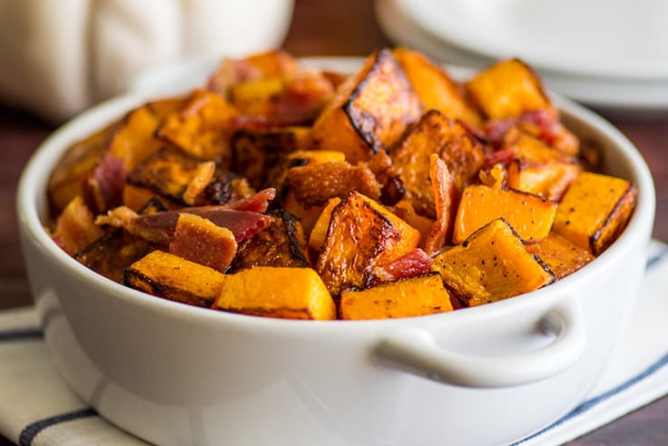 Bacon and butternut squash side dish in a serving dish.
