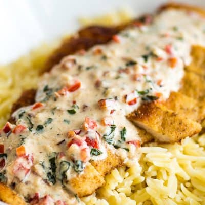 Easy Chicken in Cream Sauce for Two, crispy breaded chicken served over orzo or rice with a two minute basil and Parmesan cream sauce. | #Chicken | #ChickenDinner | #DinnerForTwo |