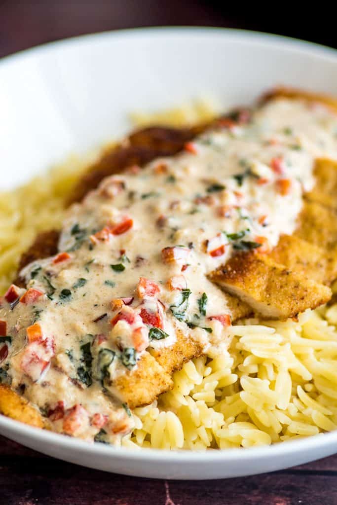 Easy Chicken in Cream Sauce for Two, crispy breaded chicken served over orzo or rice with a two-minute basil and Parmesan cream sauce. | #Chicken | #ChickenDinner | #DinnerForTwo |