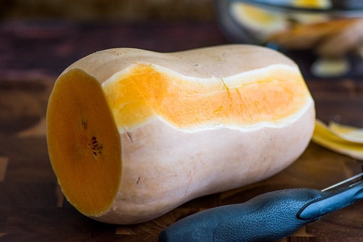 Butternut squash being peeled.