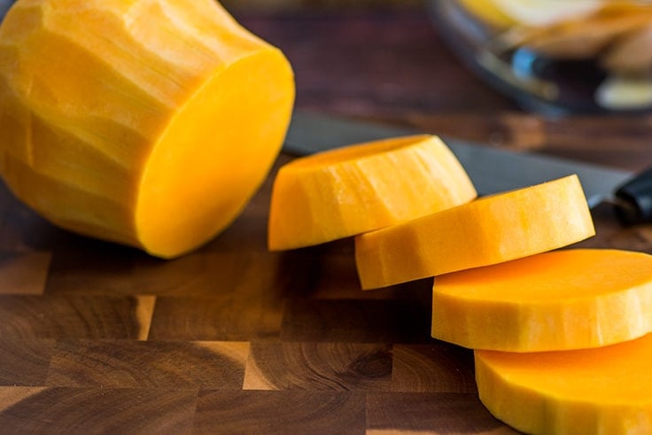 Butternut squash cut into rounds.