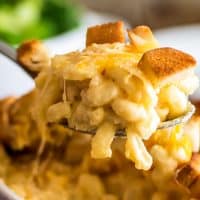 Mac and cheese for two being spooned out of a dish.