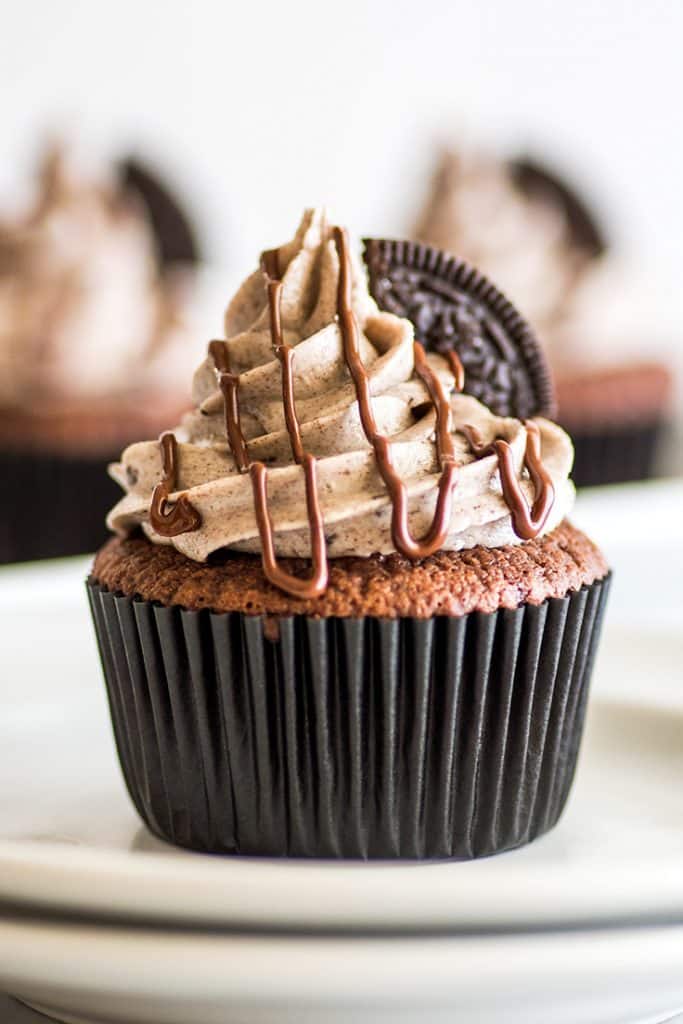 Small-batch Oreo Cupcakes, moist chocolate cupcakes with an Oreo baked right into them and the best Oreo frosting on top! | #cupcakes | #Oreos | Small-batch Desserts |
