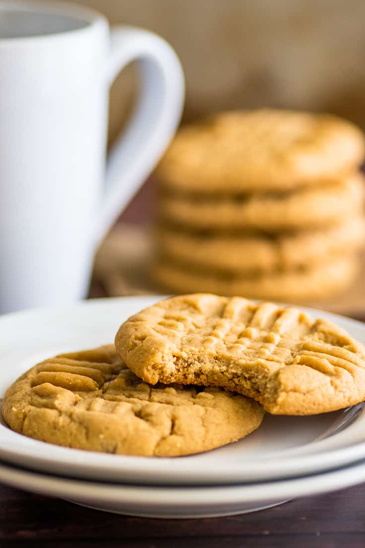 Two peanut butter cookies on a plate.