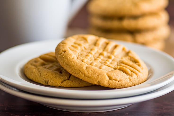 Small-batch peanut butter cookies on a white plate.