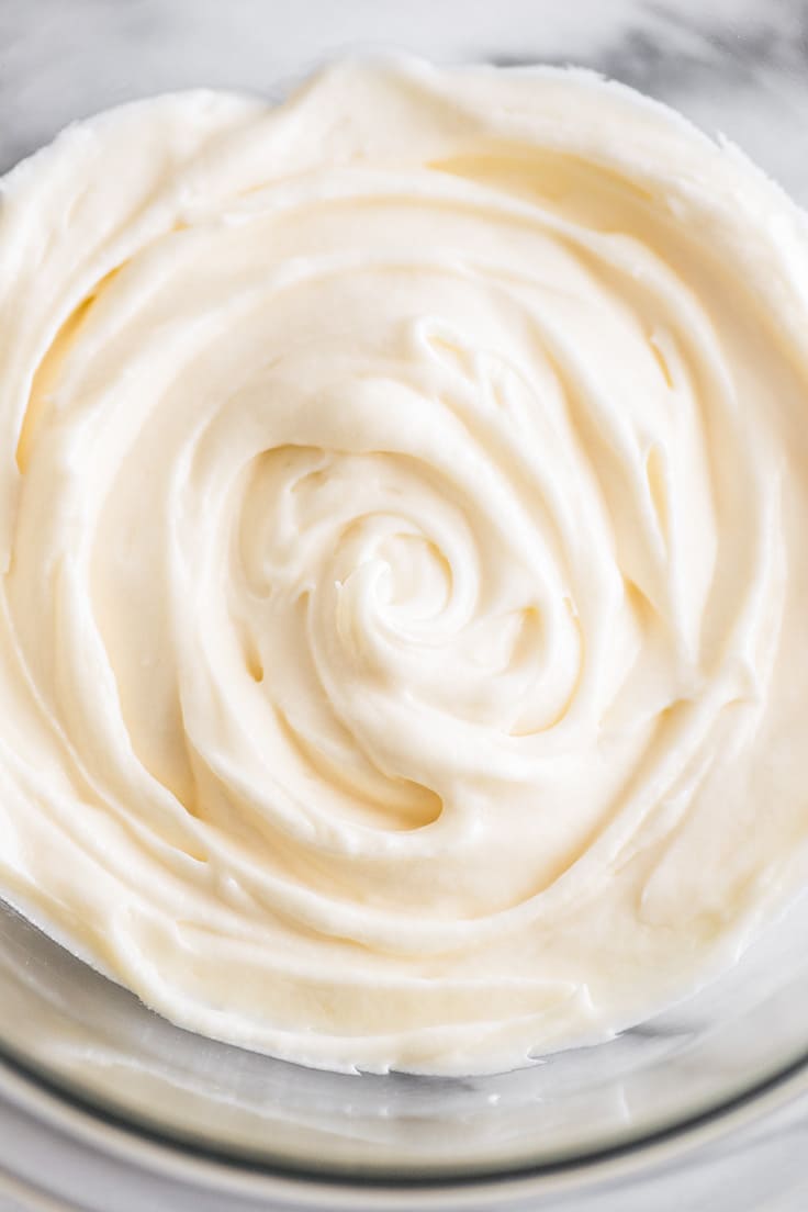 Small-batch cream cheese frosting in a glass bowl.
