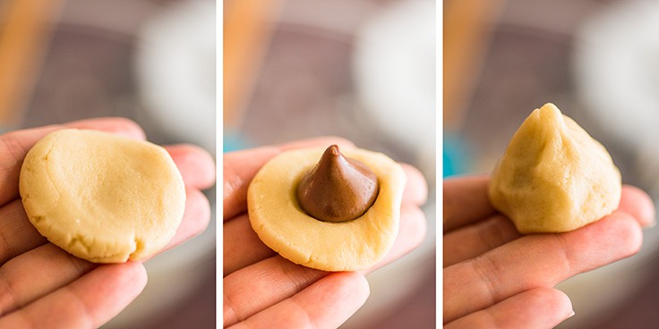 Small-batch snowball cookies being assembled around a chocolate Kiss.