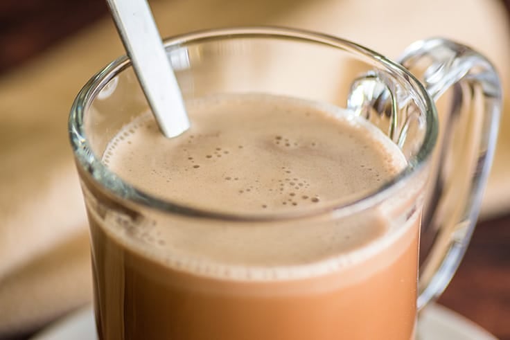 Cup of cafe mocha with a spoon.