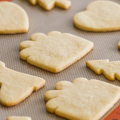 Small batch of sugar cookies cut out and baked on a baking sheet.