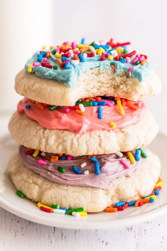 Stack of three Small-batch Frosted Sugar Cookies on a plate.
