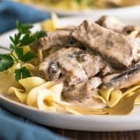 Photo of Easy Beef Stroganoff over egg noodles on a plate.