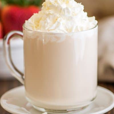 Photo of homemade white chocolate mocha with whipped cream and white chocolate shavings.