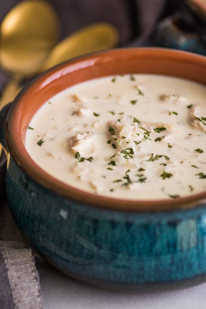 This easy Keto Chicken and "Rice" Soup is rich, creamy, and the BEST keto comfort food. | #keto | #cauliflowerrice | #ketorecipe | Photo of easy Keto Chicken Soup served up in a bowl.