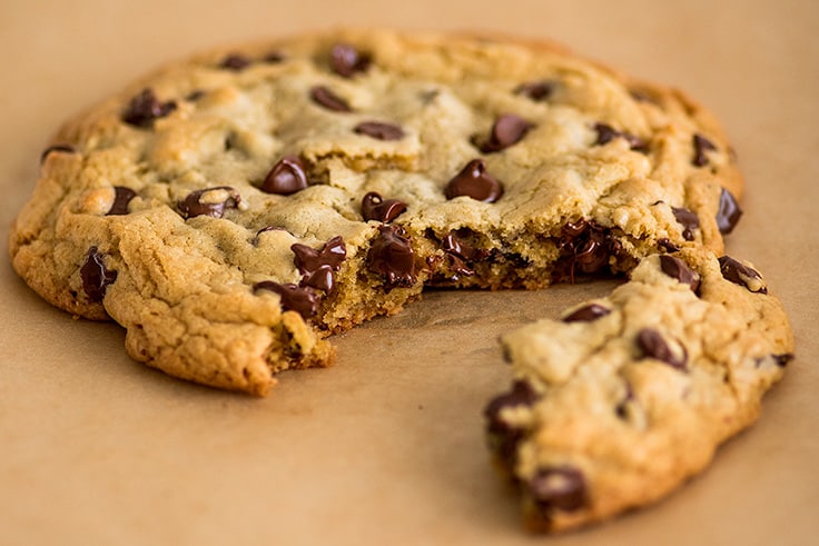 Photo of One Chocolate Chip Cookie for Two split into two pieces.