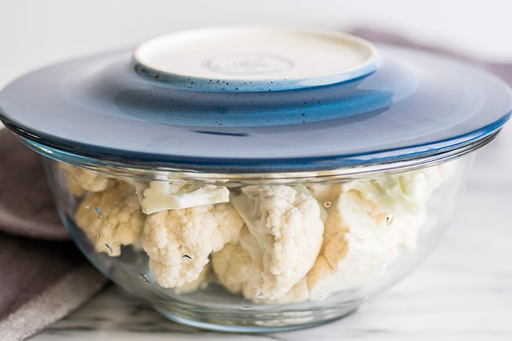 How to Steam Cauliflower in the Microwave step two photo of chopped cauliflower in bowl ready to be steamed.