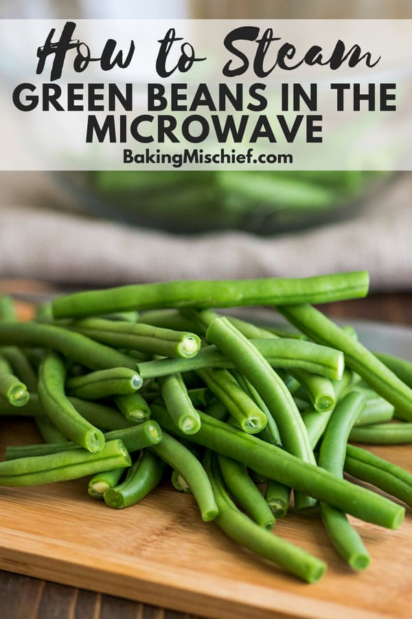 How to Steam Green Beans in the Microwave for a quick, simple, and delicious weeknight side dish. | easy side dishes | vegetable side dishes | green beans | Fresh green beans on a cutting board with text overlay: How to Steam Green Beans in the Microwave.