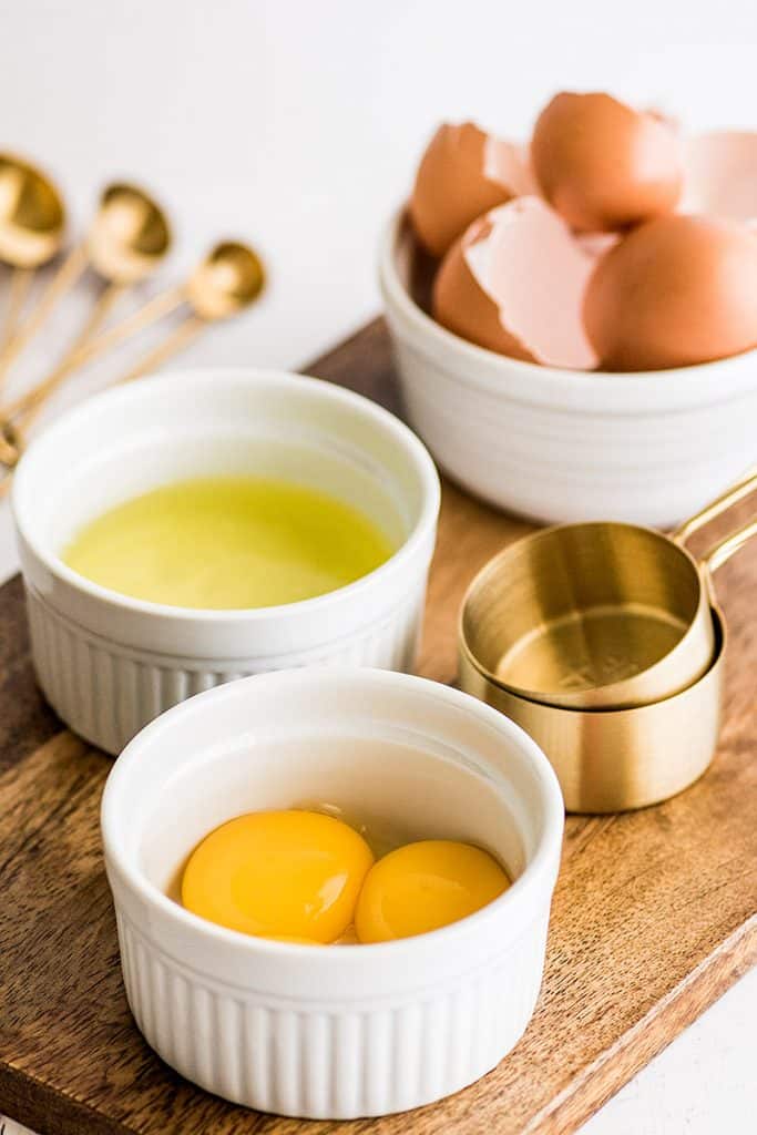 Photo of egg yolks in white ramekin to use in egg yolk recipes.