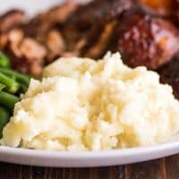 Mashed Potatoes for Two on a plate with ribs and green beans.