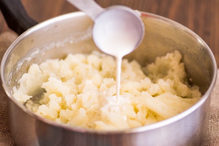 Mashed Potatoes for Two Photo Step 5: cream being added to mashed potatoes.