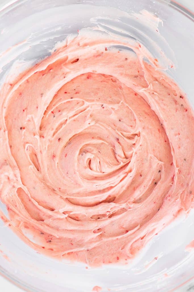 Overhead photo of small-batch strawberry frosting in a glass bowl.