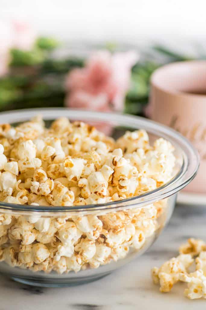 Brown Sugar Kettle Corn is kettle corn’s slightly more fun and mature sibling. Salty, sweet, and just a bit caramelly, it’s perfect for movie night or an afternoon snack. | #snack | #kettlecorn | #brownsugar | Tall photo of Brown Sugar Kettle Corn.