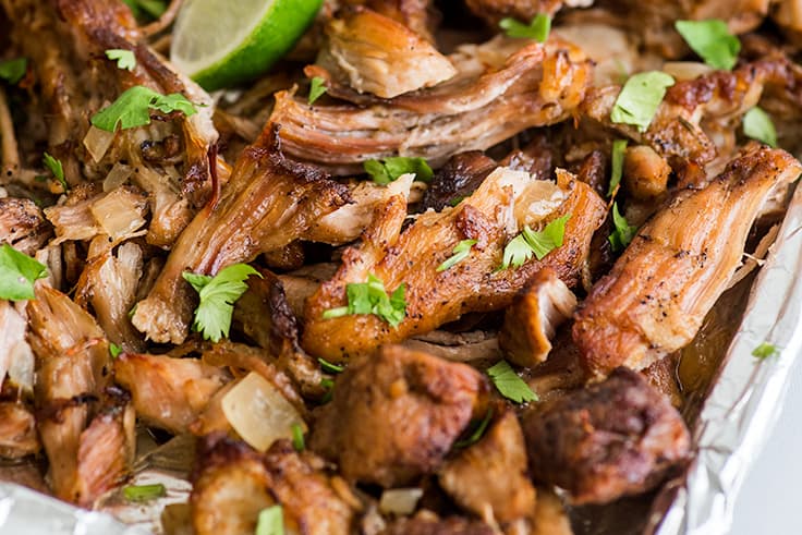 Photo of carnitas on a tray for Carnitas Burrito Bowls.
