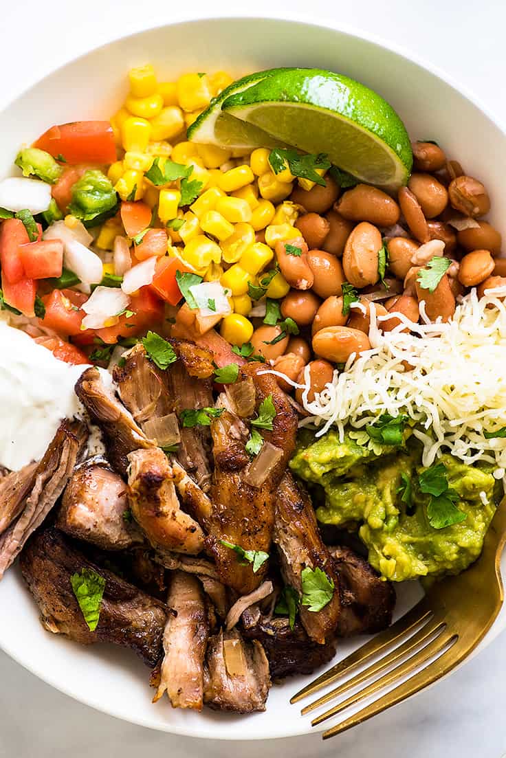 Overhead shot of Carnitas Burrito Bowls in a white bowl.