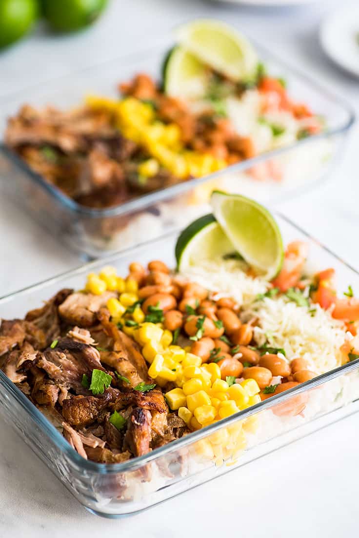 Photo of two meal prep carnitas burrito bowls.