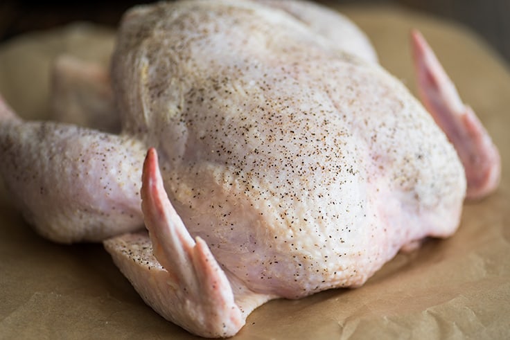 Photo of roasted chicken step 3, raw chicken seasoned.