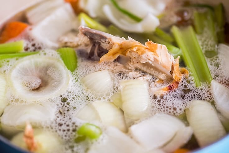 Image of homemade chicken stock simmering.