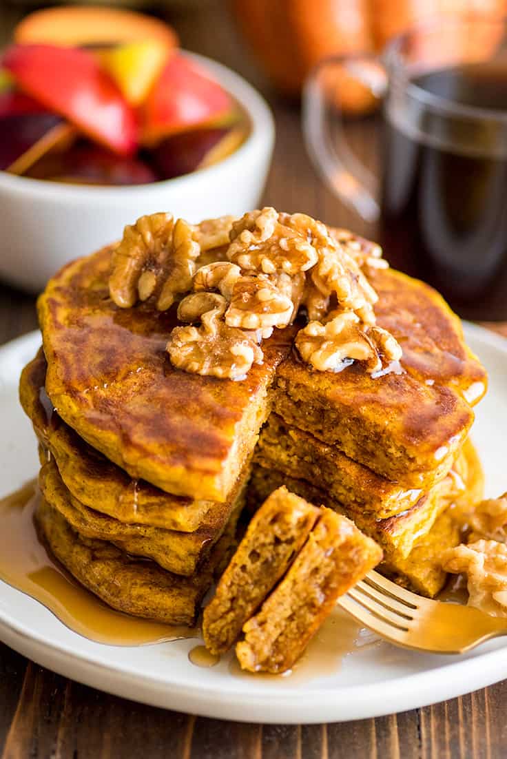 Photo of stack of Pumpkin Pancakes for Two with pieces on a fork.