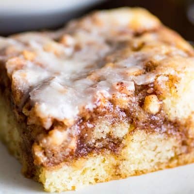 Picture of slice of Small Apple Cinnamon Cake on a white plate.