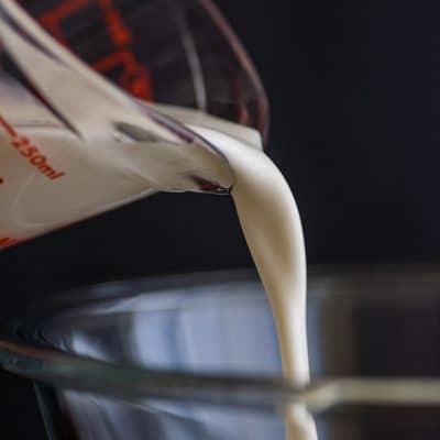 Photo of heavy cream being poured into a bowl.