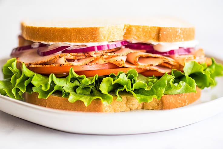 Picture of a turkey sandwich made with garlic aioli.