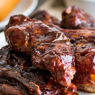 Photo of country-style pork ribs piled on a plate.