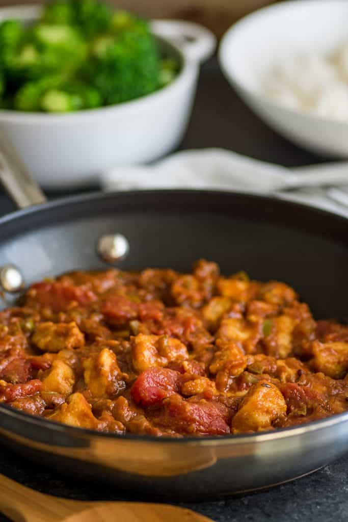 This easy chicken curry is an all-time favorite in my family and a super quick and simple weeknight meal. | #chickencurry | #chicken | #bonelessskinlesschickenbreasts | Image of Easy Chicken Curry in pan.