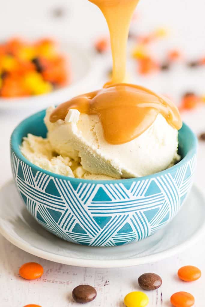 Love this peanut butter sauce! Two ingredients and 30 seconds are all you need to make this single-serving peanut butter sauce for ice cream, pancakes, or waffles. | #summerdessert | #peanutbutter | #recipeforone | recipes for one | Peanut Butter Sauce being poured over ice cream.