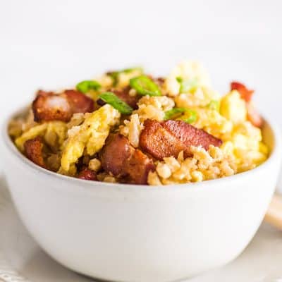 Close image of keto fried rice in a white bowl.