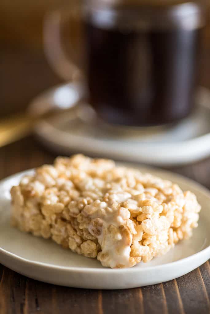Picture of single-serve rice krispie treat on a white plate.