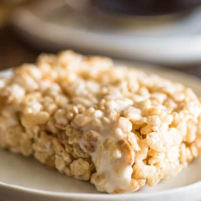 Picture of single-serve rice krispie treat on a white plate.