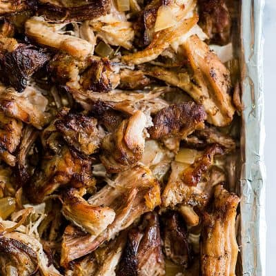 Crispy Slow Cooker Carnitas on a baking tray.