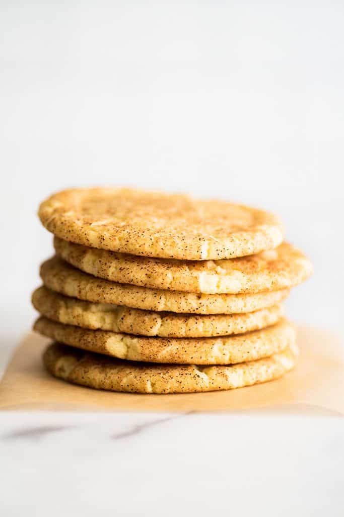 Stack of Small-batch Snickerdoodles on parchment paper.