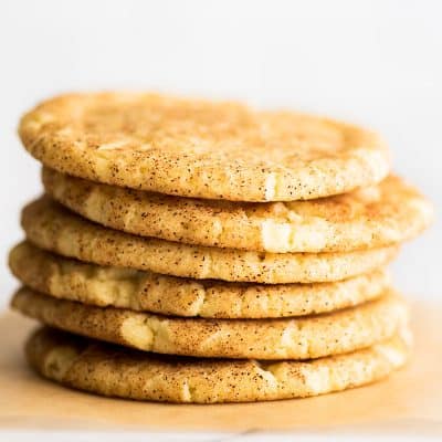 Stack of Small-batch Snickerdoodles on parchment paper.