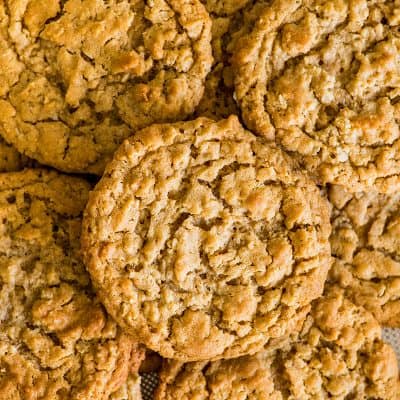 Photo of Peanut Butter Oatmeal Cookies in a pile on a cookie sheet.