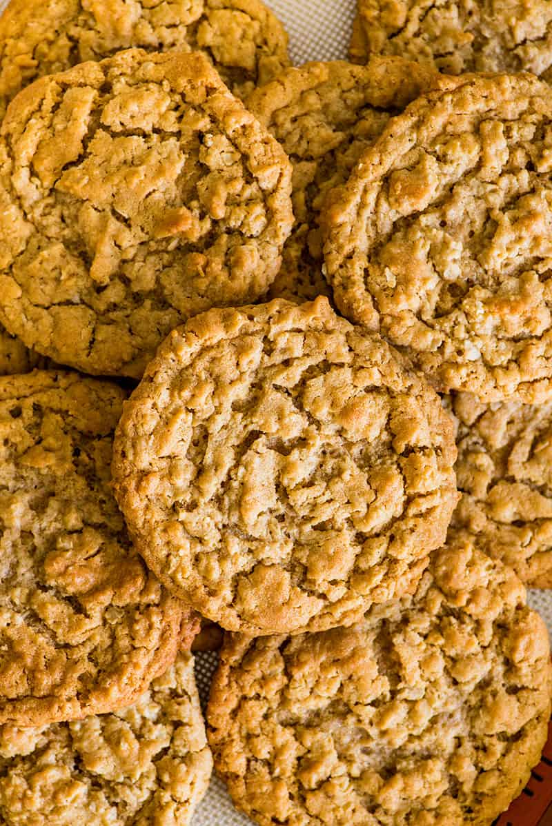 Photo of Peanut Butter Oatmeal Cookies in a pile on a cookie sheet.