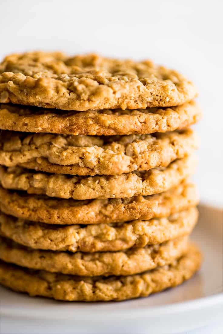 Stack of Peanut Butter Oatmeal Cookies on a white plate.