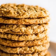 Easy Peanut Butter Oatmeal Cookies stacked on a plate.