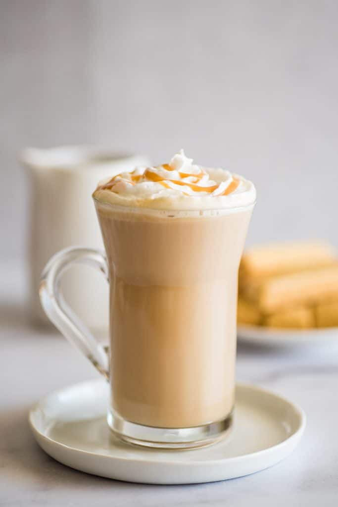 Dulce de leche latte on a glass cup.