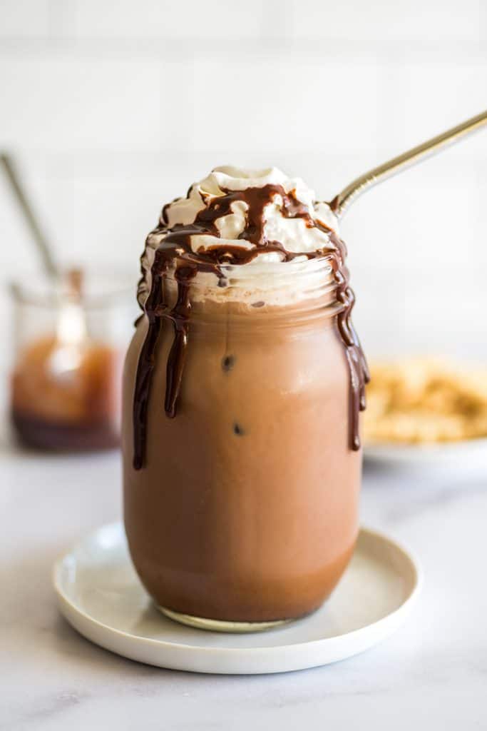Homemade iced mocha in a mason jar.