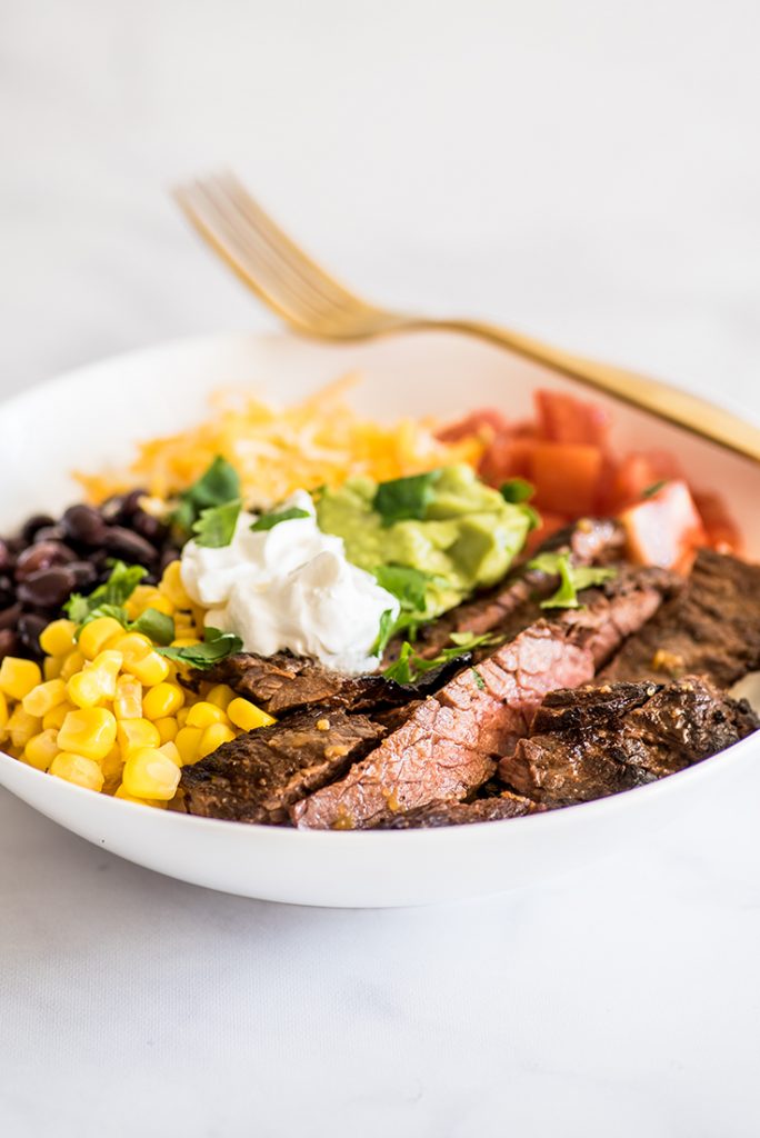 Photo of Carne Asada Burrito Bowl in a white bowl.